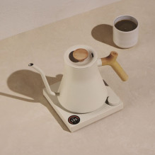 Fellow Stagg EKG PRO 900ml electric kettle in sesame beige with a wooden handle